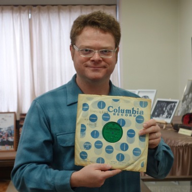 At the Suzuki Museum, holding Suzuki's copy of the 78 recording of his Twinkle Variations